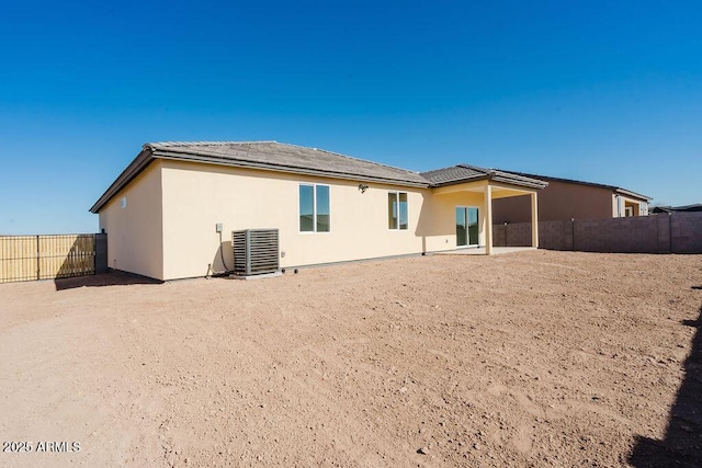 rear view of property featuring central air condition unit