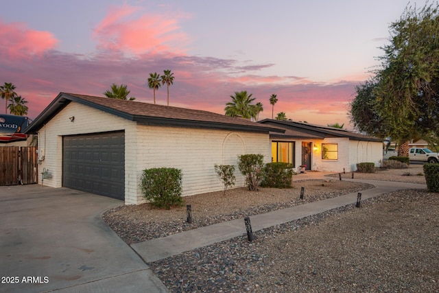 12866 W Orange Dr, Litchfield Park, AZ 85340 - view of front of home with a garage and brick siding