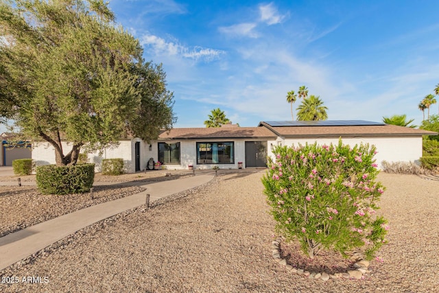 12866 W Orange Dr, Litchfield Park, AZ 85340 - view of front of property featuring roof mounted solar panels and brick siding