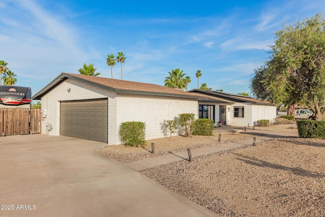 12866 W Orange Dr, Litchfield Park, AZ 85340 - ranch-style home featuring concrete driveway, brick siding, and an attached garage