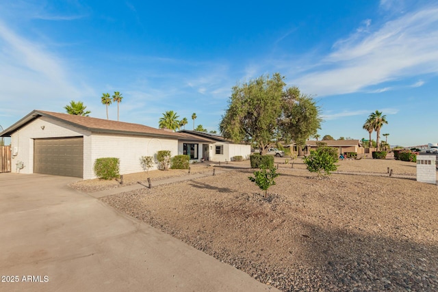 12866 W Orange Dr, Litchfield Park, AZ 85340 - ranch-style house featuring driveway, an attached garage, and brick siding
