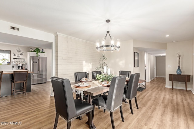 12866 W Orange Dr, Litchfield Park, AZ 85340 - dining space with a chandelier, light wood-type flooring, baseboards, and recessed lighting