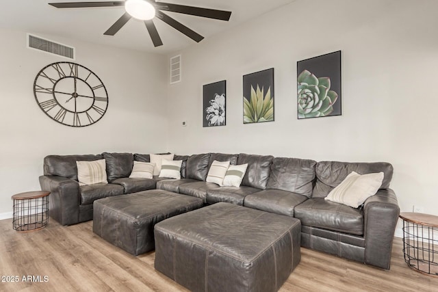12866 W Orange Dr, Litchfield Park, AZ 85340 - living room with light wood finished floors, a ceiling fan, and baseboards