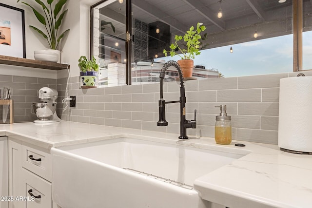 12866 W Orange Dr, Litchfield Park, AZ 85340 - detailed view of a sink and decorative backsplash