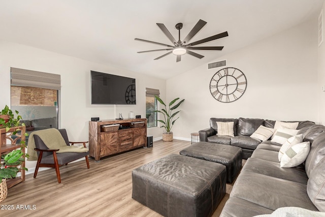 12866 W Orange Dr, Litchfield Park, AZ 85340 - living area with a ceiling fan, light wood finished floors, vaulted ceiling, and baseboards