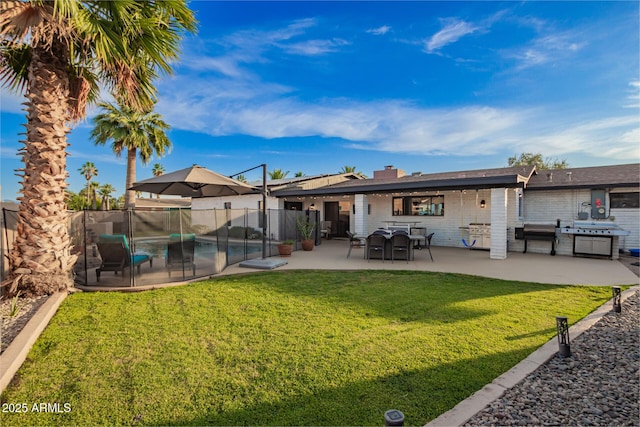 12866 W Orange Dr, Litchfield Park, AZ 85340 - rear view of property with a patio area and a chimney