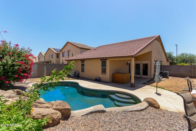 25060 W Vista Norte St, Buckeye, AZ 85326 - view of swimming pool featuring french doors, a fenced backyard, a patio, and central AC
