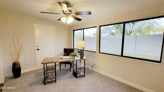 carpeted home office with ceiling fan