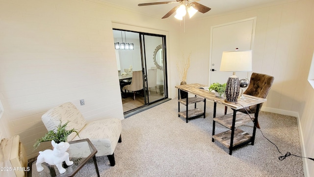 carpeted office space with ceiling fan and ornamental molding