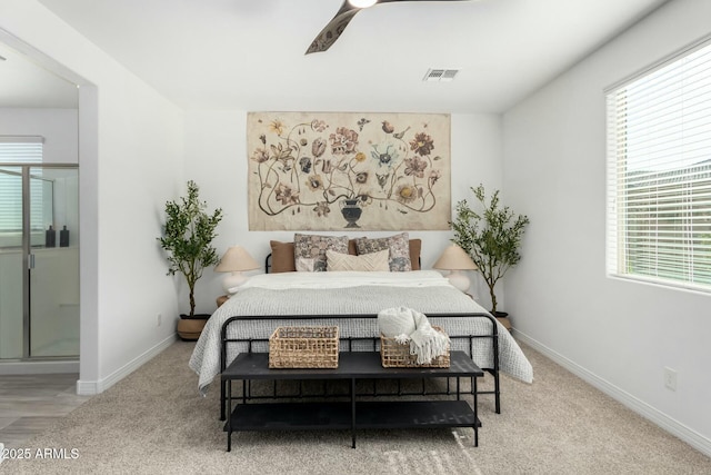 bedroom with ceiling fan, carpet, and multiple windows