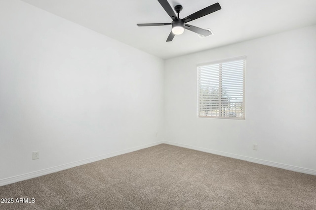 carpeted empty room featuring ceiling fan