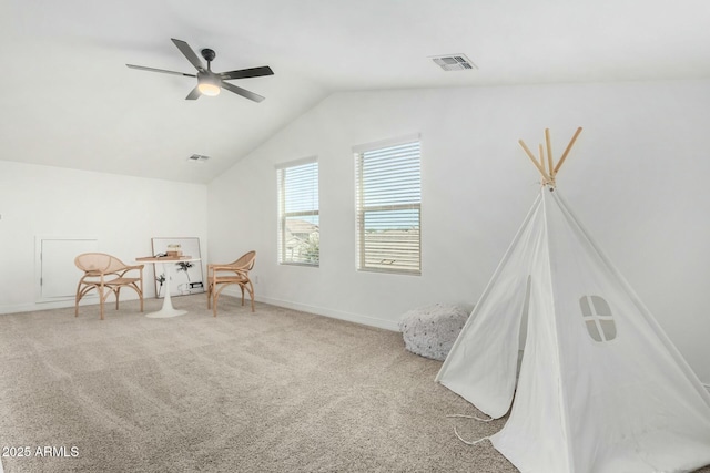 rec room featuring ceiling fan, carpet flooring, and lofted ceiling