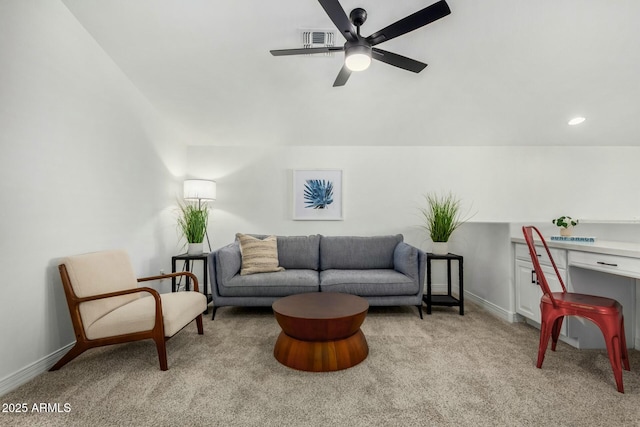 living room featuring ceiling fan and light carpet