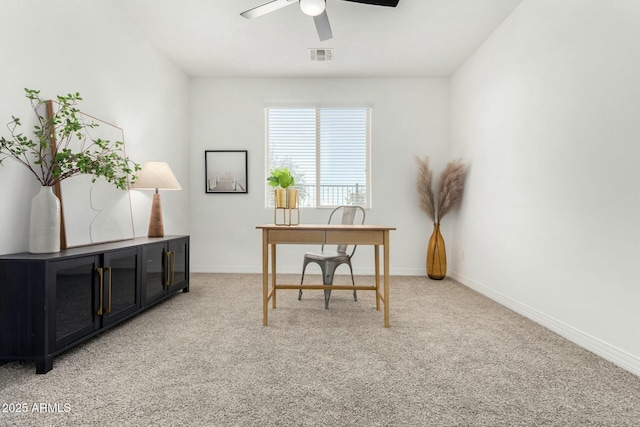 carpeted office with ceiling fan