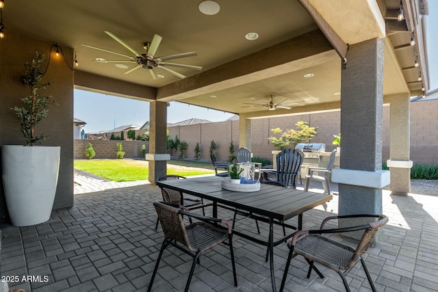 view of patio / terrace featuring ceiling fan and a grill