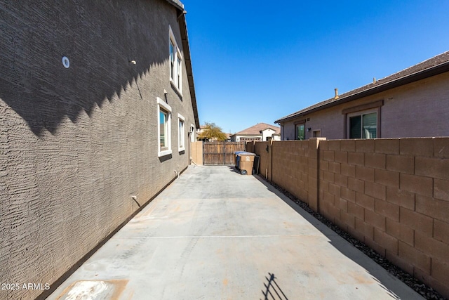 view of side of home featuring a patio area