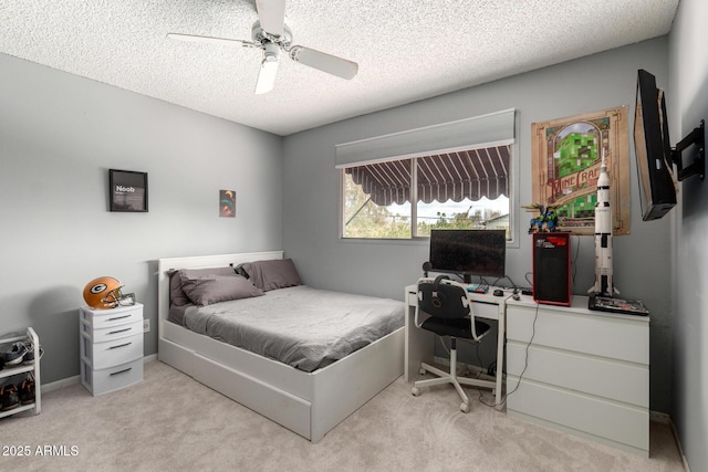 bedroom with light carpet, a textured ceiling, and ceiling fan