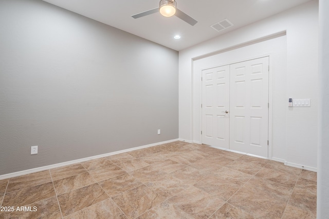 unfurnished bedroom with visible vents, baseboards, and a closet