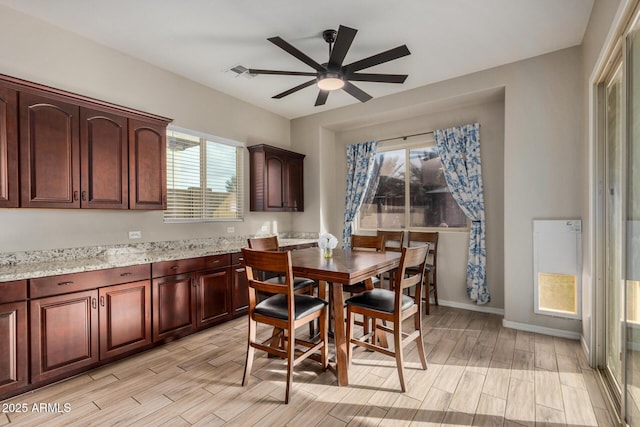 dining space featuring ceiling fan