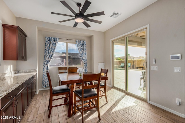 dining room featuring ceiling fan