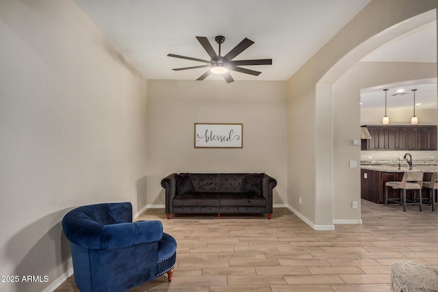 living area with ceiling fan