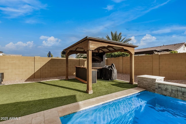 view of swimming pool featuring a gazebo and a yard