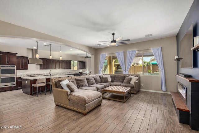 living room featuring ceiling fan