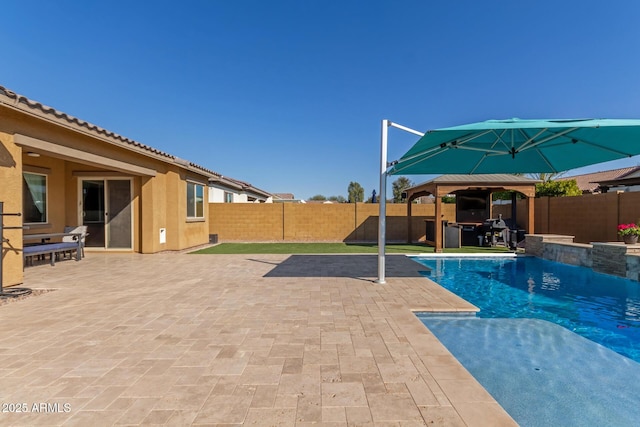 view of swimming pool with a gazebo and a patio area