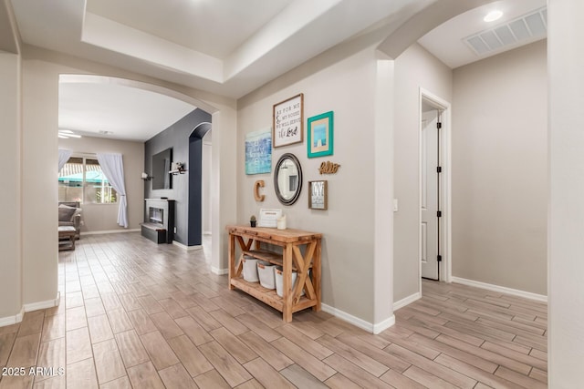 corridor with a tray ceiling