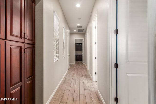 hall with light wood-type flooring