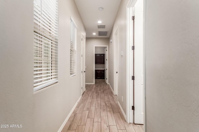 corridor featuring light wood-type flooring