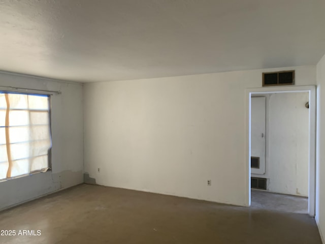 empty room featuring concrete floors