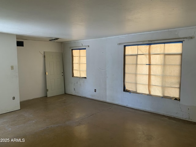 empty room featuring concrete flooring