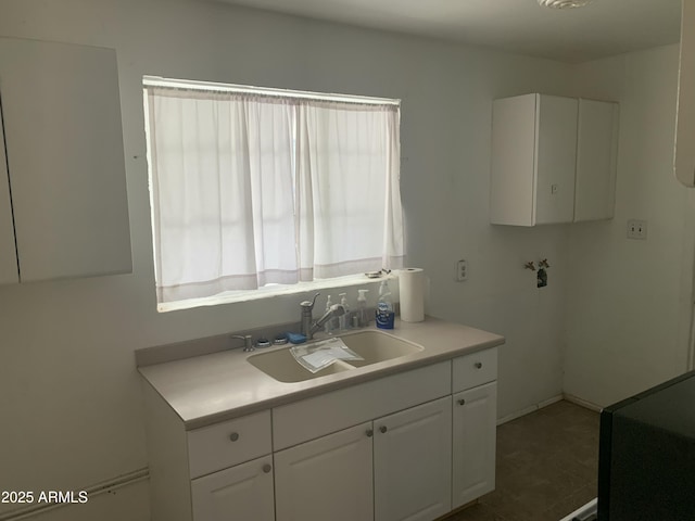 kitchen with sink and white cabinets