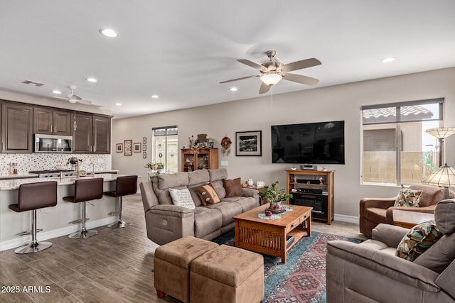 16756 S 181st Ln, Goodyear, AZ 85338 - living room with ceiling fan, plenty of natural light, recessed lighting, and wood finished floors