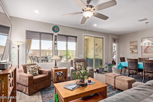 16756 S 181st Ln, Goodyear, AZ 85338 - living area featuring wood finished floors, a ceiling fan, and recessed lighting