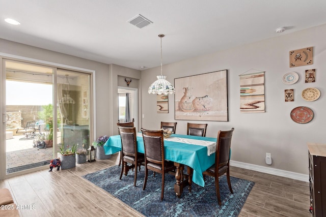 16756 S 181st Ln, Goodyear, AZ 85338 - dining space featuring plenty of natural light and wood finished floors