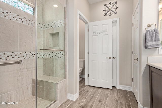 16756 S 181st Ln, Goodyear, AZ 85338 - bathroom with a shower stall, vanity, and wood finish floors