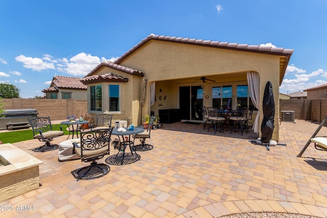 16756 S 181st Ln, Goodyear, AZ 85338 - fenced backyard with outdoor dining space, a patio area, ceiling fan, and a hot tub
