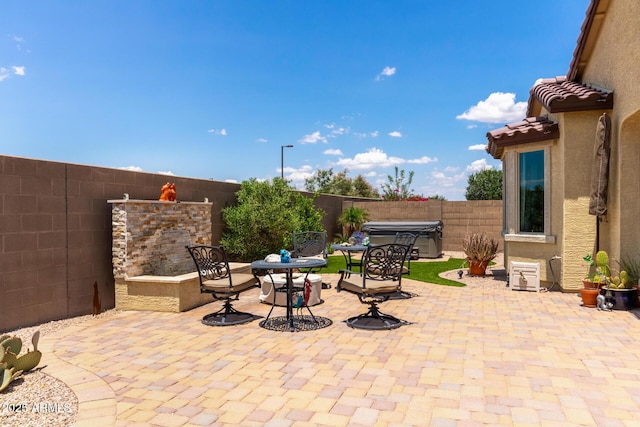 16756 S 181st Ln, Goodyear, AZ 85338 - fenced backyard featuring a patio area, a hot tub, and a grill
