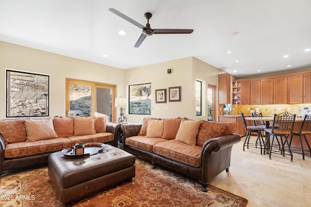 living room with light tile patterned flooring, a ceiling fan, and recessed lighting