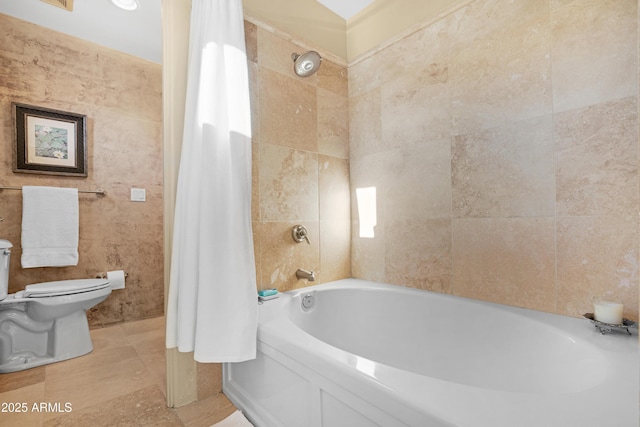 bathroom with tile walls and toilet