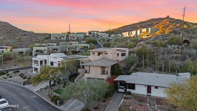 birds eye view of property featuring a mountain view