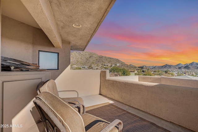 balcony at dusk with a mountain view