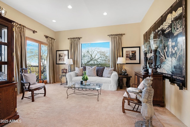 sitting room with recessed lighting and light colored carpet