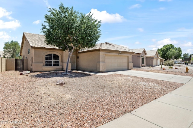 351 N Danyell Dr, Chandler, AZ 85225 - view of front of house with stucco siding, driveway, a tiled roof, and an attached garage