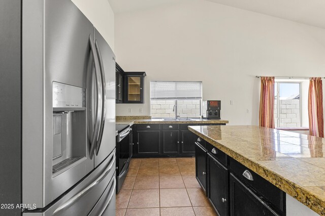 351 N Danyell Dr, Chandler, AZ 85225 - kitchen featuring stainless steel appliances, tile counters, a sink, dark cabinetry, and light tile patterned floors