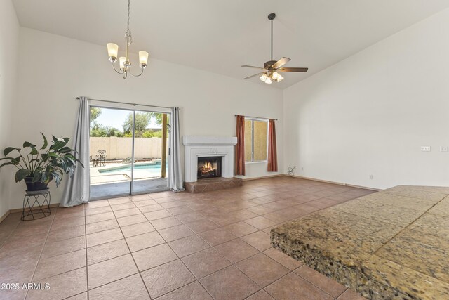 351 N Danyell Dr, Chandler, AZ 85225 - unfurnished living room with tile patterned flooring, a ceiling fan, high vaulted ceiling, a chandelier, and a tiled fireplace