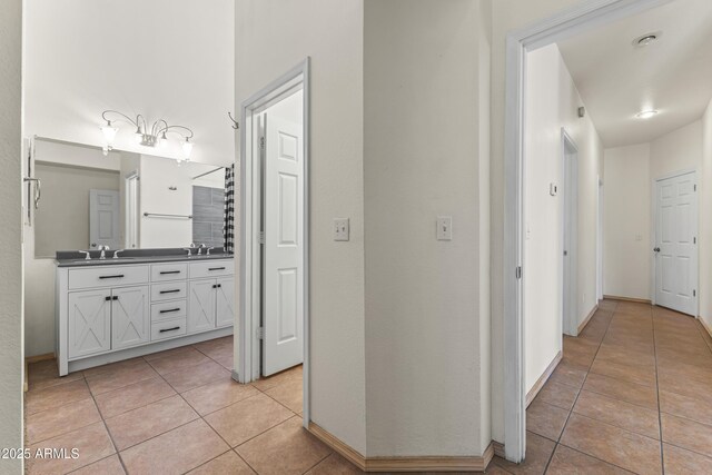 351 N Danyell Dr, Chandler, AZ 85225 - hallway with light tile patterned floors, a sink, and baseboards