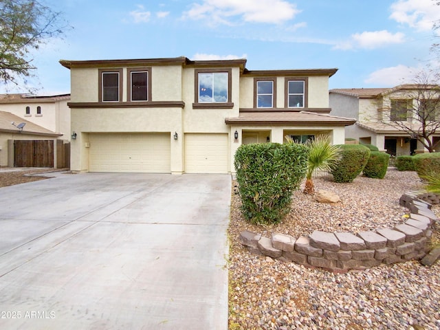 prairie-style home featuring stucco siding, concrete driveway, and a garage